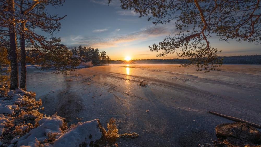 Winter Sunset Over Frozen Lake wallpaper