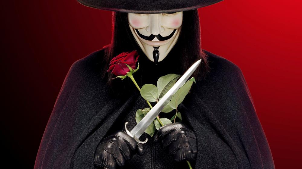 Mysterious Figure in Guy Fawkes mask with Rose and Blade wallpaper