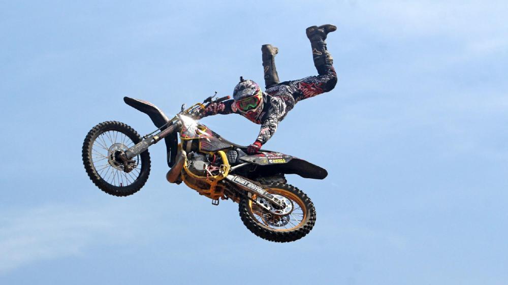 High-Flying Motocross Stunt in the Sky wallpaper