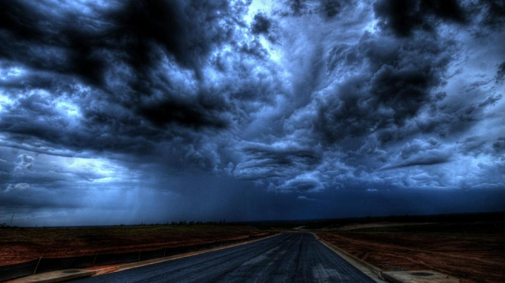 Storm's Fury Unleashed Above Lonely Road wallpaper