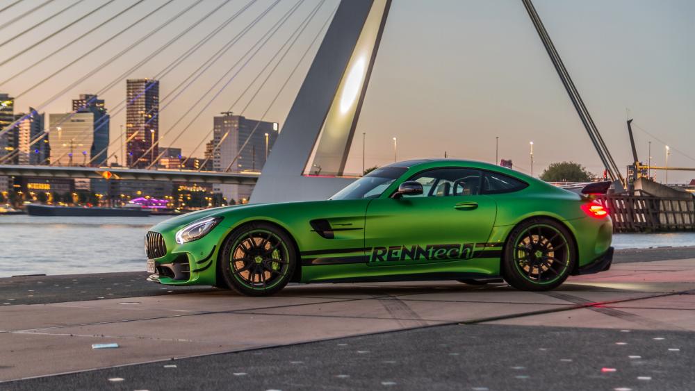 Green Mercedes-Benz AMG GT at Dusk Cityscape wallpaper