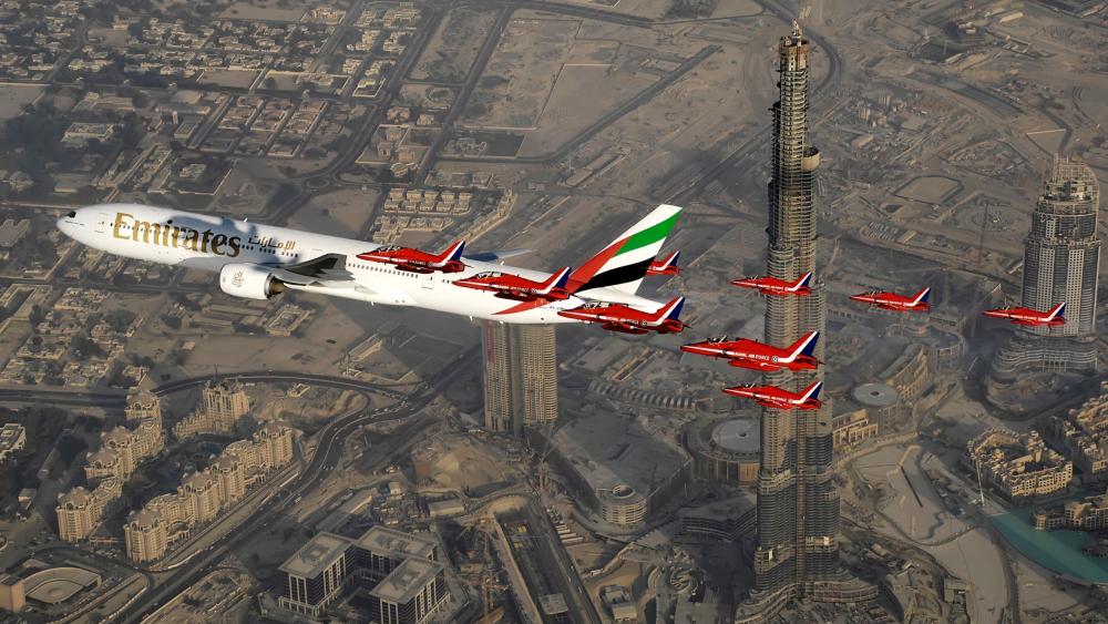 Emirates Airline Soaring High Above Dubai wallpaper