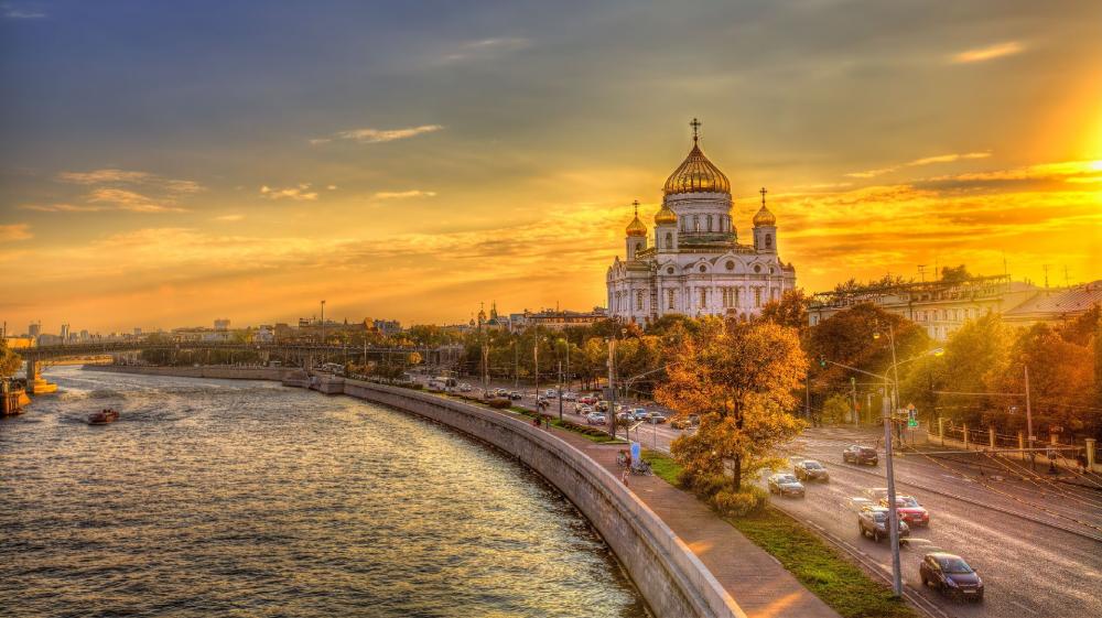 Golden Sunset over the Cathedral by the River wallpaper