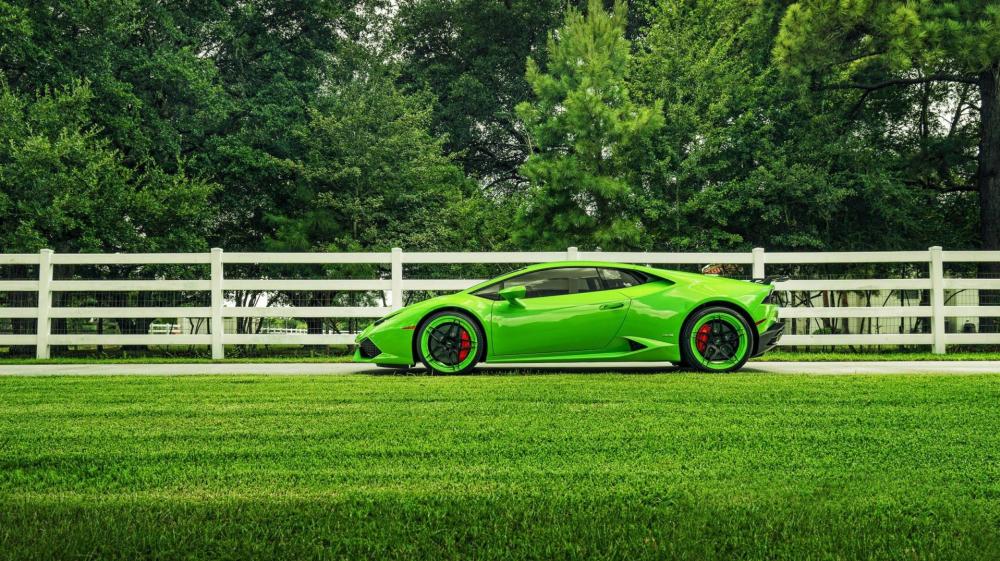 Green Supercar Bliss Amidst Nature's Embrace wallpaper