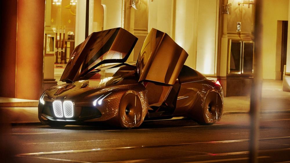 Gleaming BMW Vision Next 100 Sports Car in Urban Elegance wallpaper