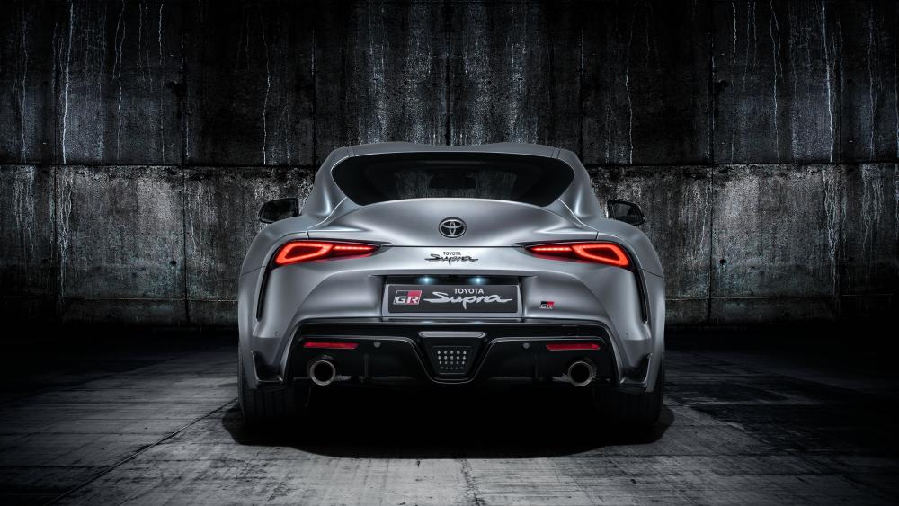 Toyota Supra GR Poised in Industrial Ambiance wallpaper