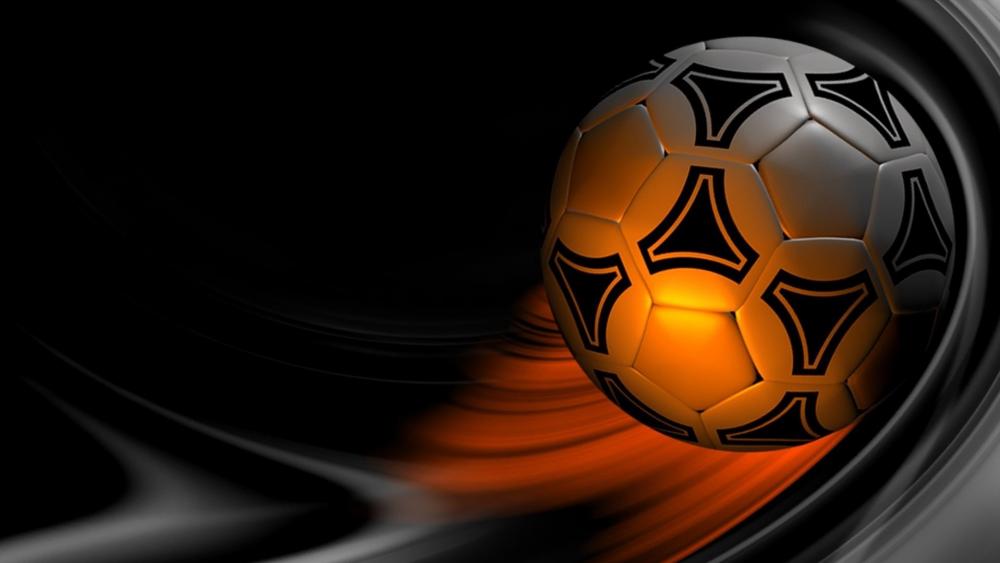 Fiery Soccer Ball Speeding Through Darkness wallpaper