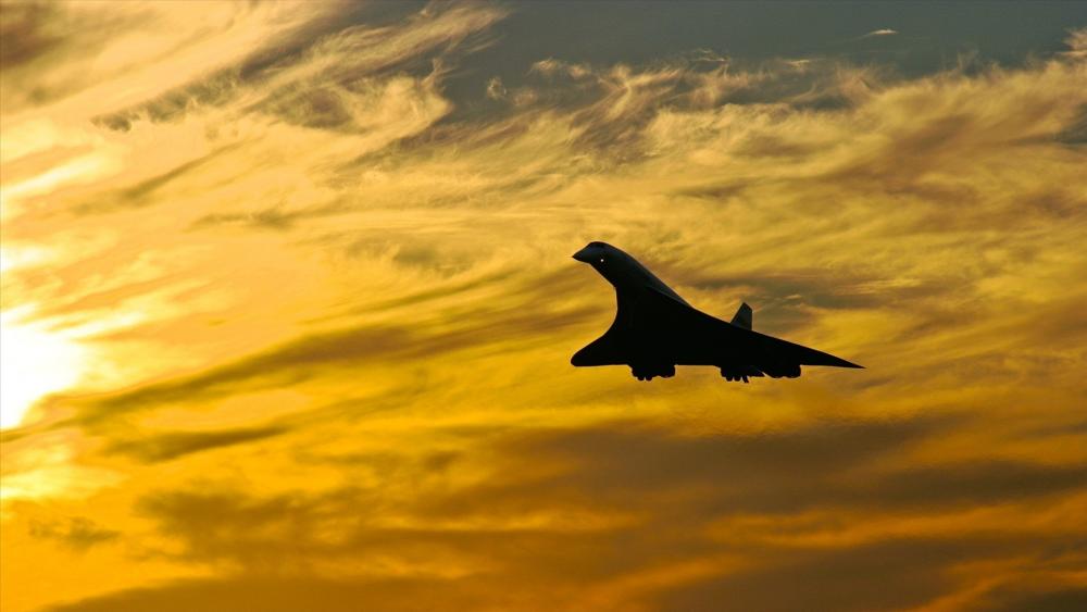 Soaring Concorde Against Sunset Sky wallpaper