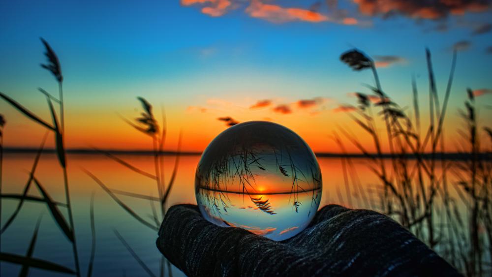 Reflective Dawn Through a Crystal Ball wallpaper
