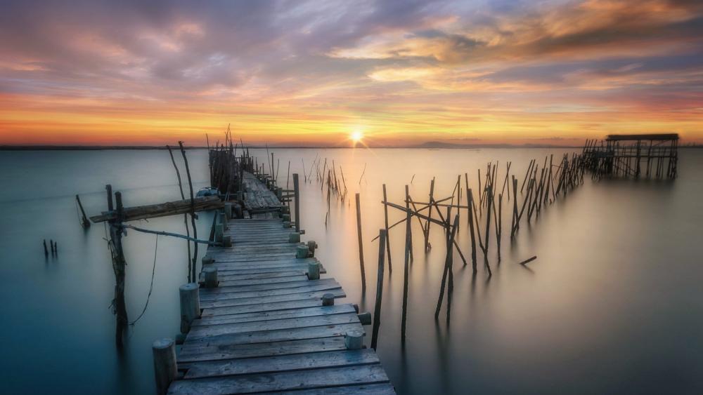 Serene Sunset at the Old Wooden Pier wallpaper