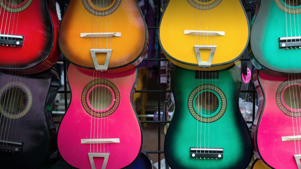 Colorful Array of Guitars Sings Diversity wallpaper