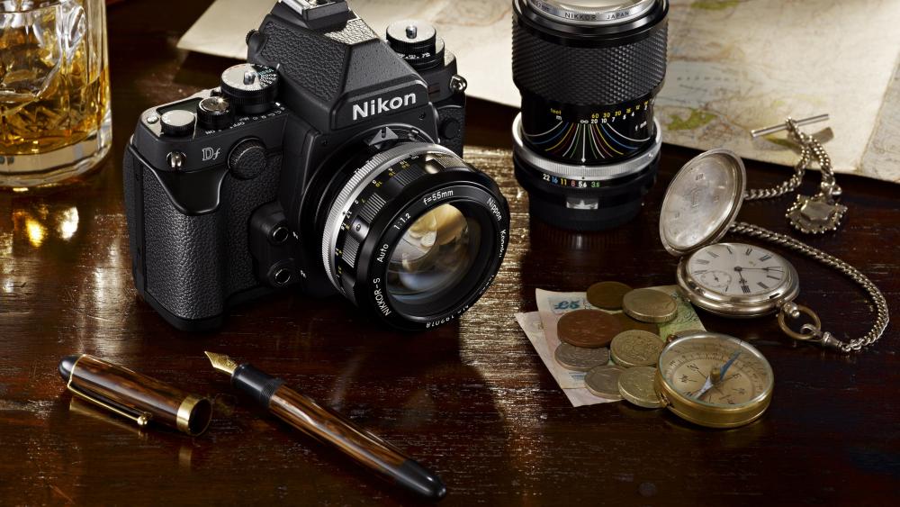 Nikon Camera Amidst Vintage Treasures wallpaper