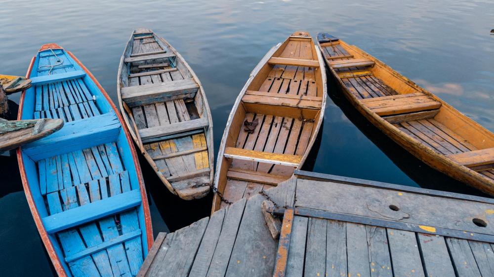 Tranquil Waters and Wooden Boats wallpaper