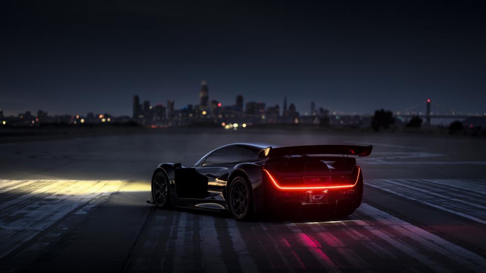 Sleek Sports Car Against Dusk Skyline wallpaper