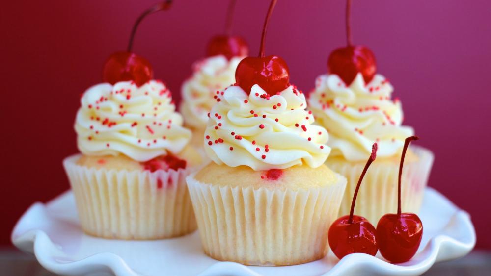 Delicious Cherry-Topped Cupcakes wallpaper