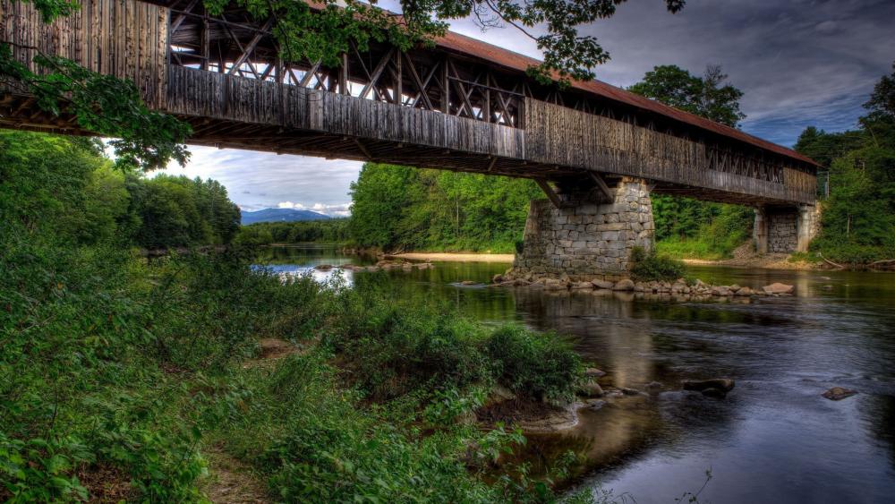 Rustic Bridge Over Tranquil Waters wallpaper