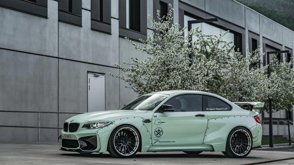BMW M2 Power Pose Against Modern Architecture wallpaper