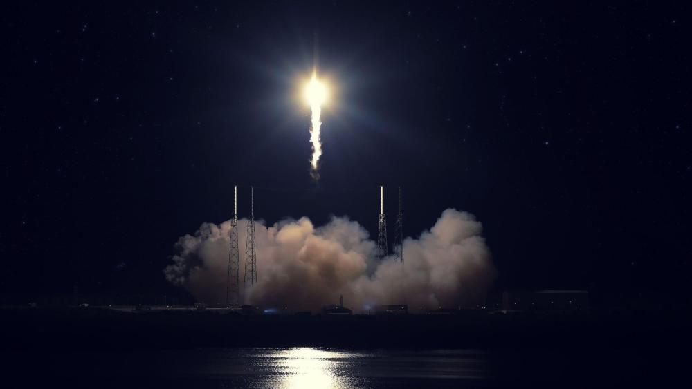 Nighttime Rocket Launch Illuminating the Sky wallpaper