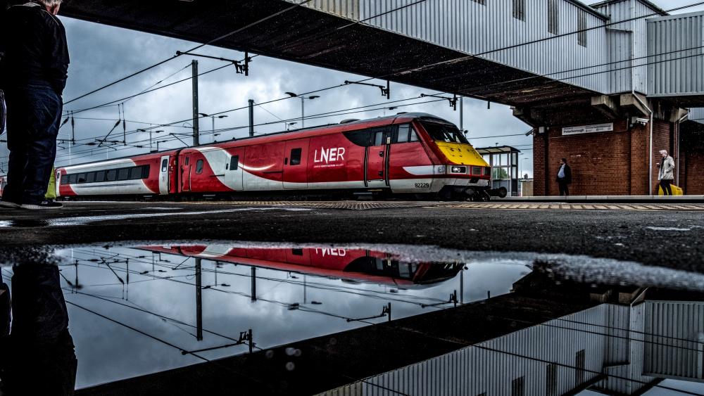 Dynamic Train Station Reflection After Rain wallpaper