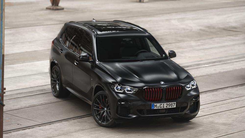 Sleek Black BMW X5 in Urban Setting wallpaper