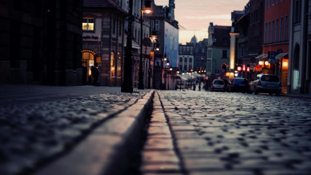 Golden Hour on Cobblestone Street wallpaper