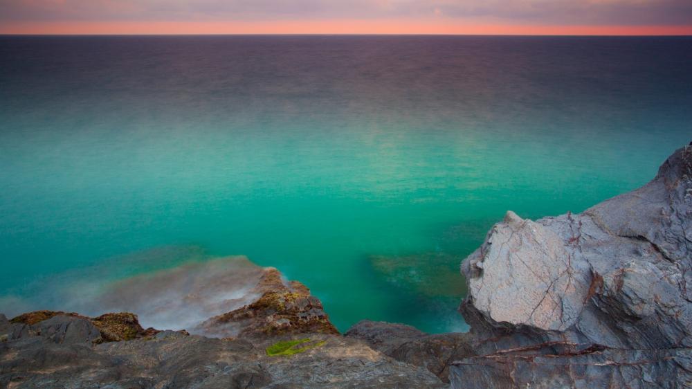 Mystic Horizon Over Tranquil Waters wallpaper