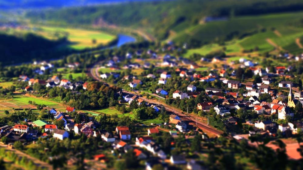 Miniature Village in Lush Valley wallpaper