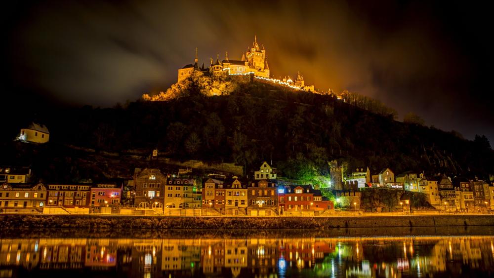 Cochem Castle Shines at Twilight wallpaper