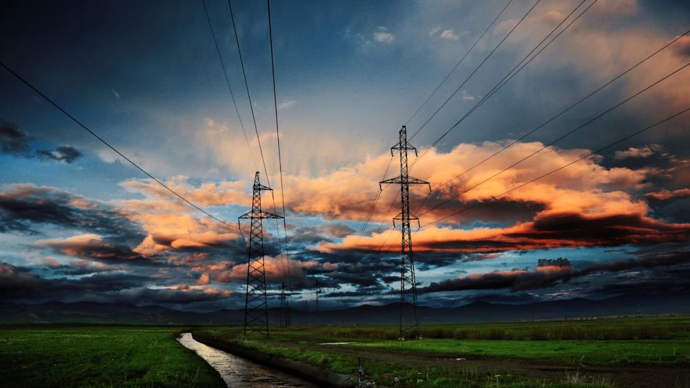 Sunset Powerlines Over Rolling Pastures wallpaper