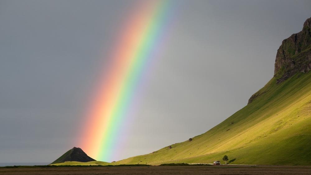 Radiant Rainbow Over Green Hills wallpaper