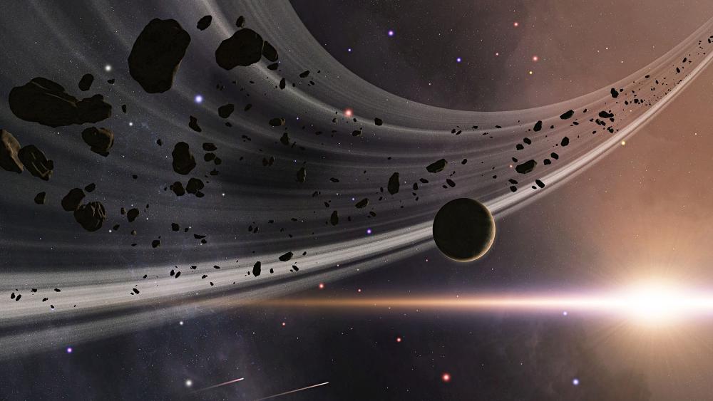 Ringed Planet with Asteroids and Cosmic Light wallpaper