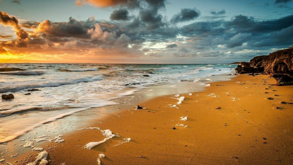 Golden Sunset on Sandy Beach wallpaper