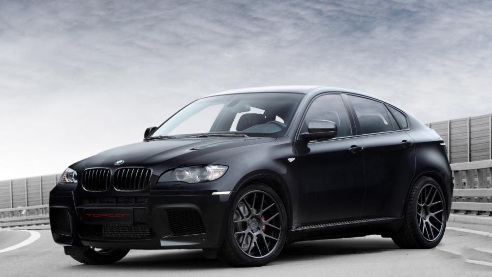 Sleek BMW X6 M in Midnight Black wallpaper