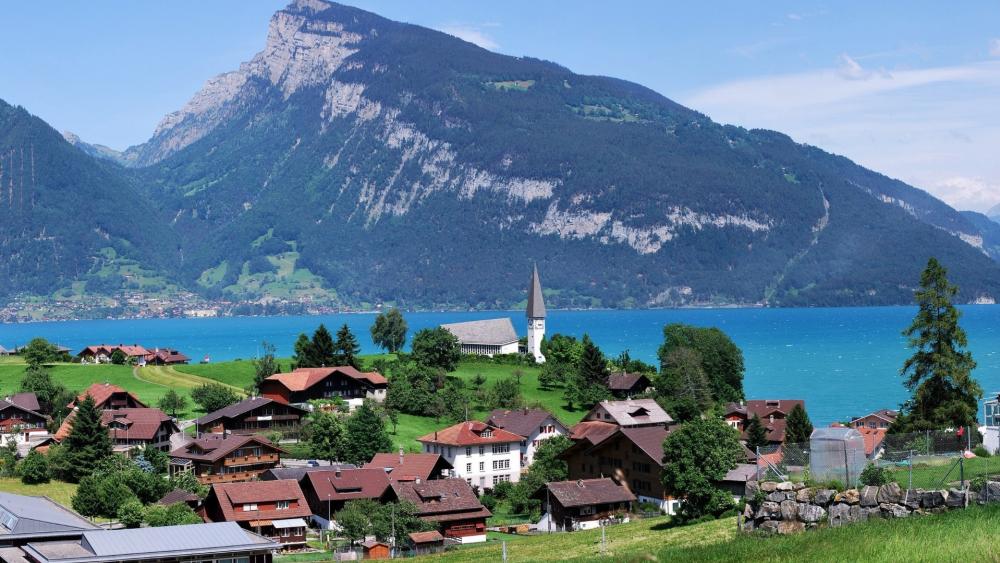 Charming Swiss Village by Lake Thun wallpaper