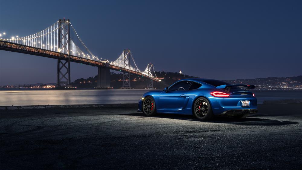 Blue Porsche Cayman GT4 by Bridge at Night wallpaper