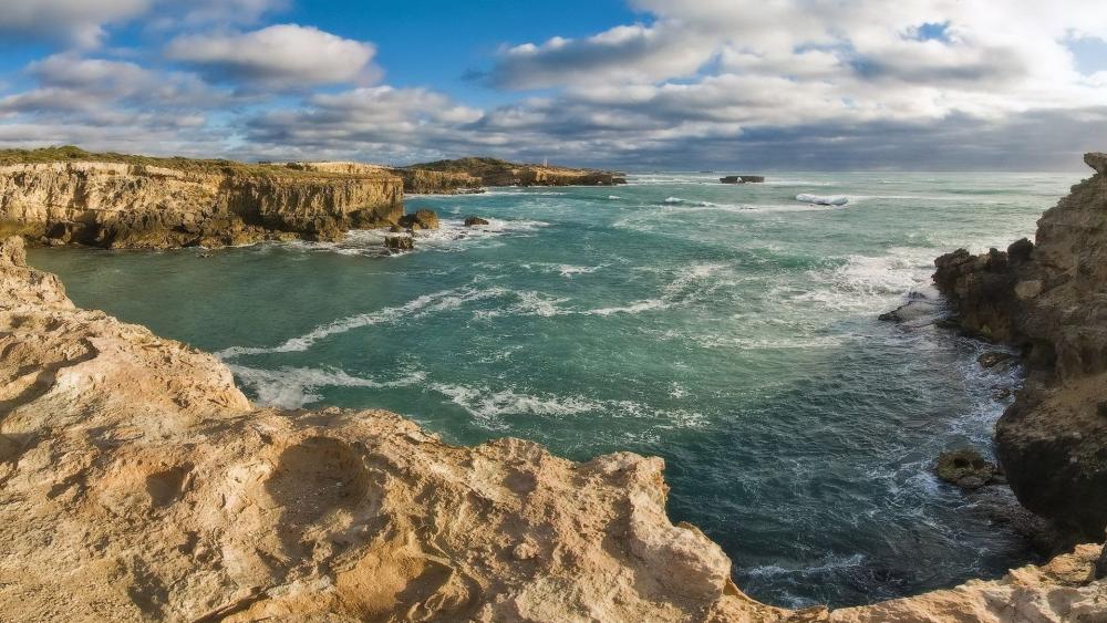 Cliffs Overlooking a Turquoise Sea wallpaper