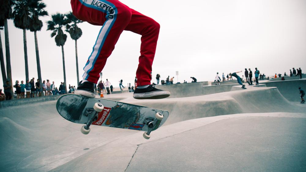 Skater Mid-Air at Popular Skatepark wallpaper