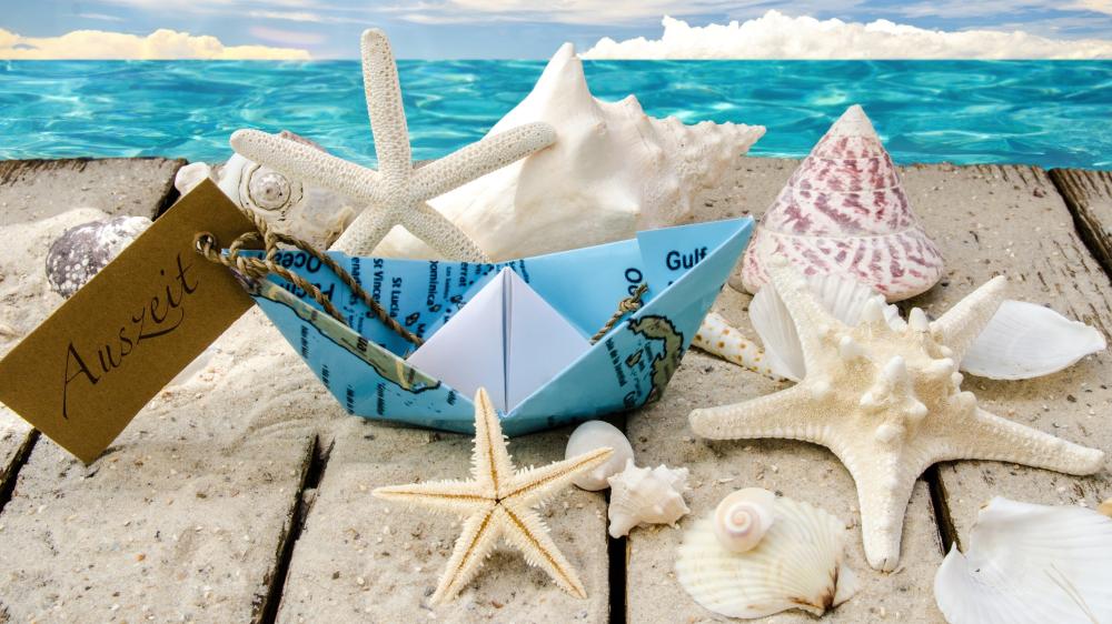 Seashells and Paper Boat on the Beach wallpaper