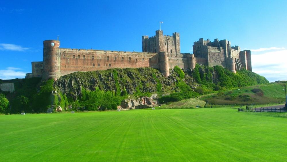 Majestic Castle on a Verdant Hilltop wallpaper