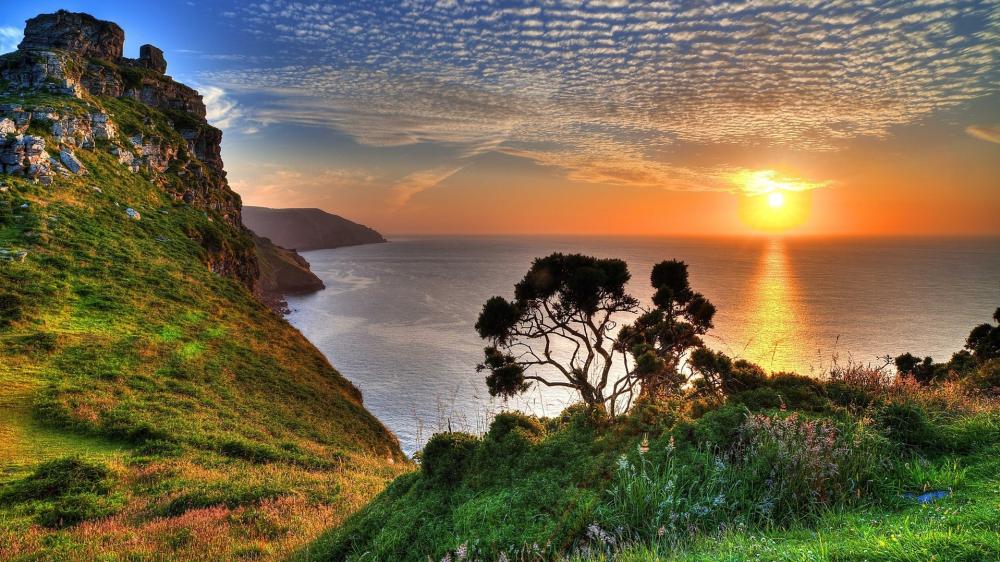 Sunset Serenity Over Clifftop Coastline wallpaper