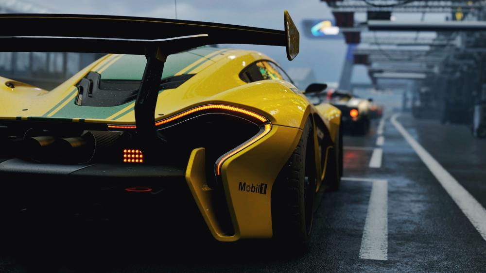 Yellow McLaren P1 GTR Supercar in Pit Lane wallpaper