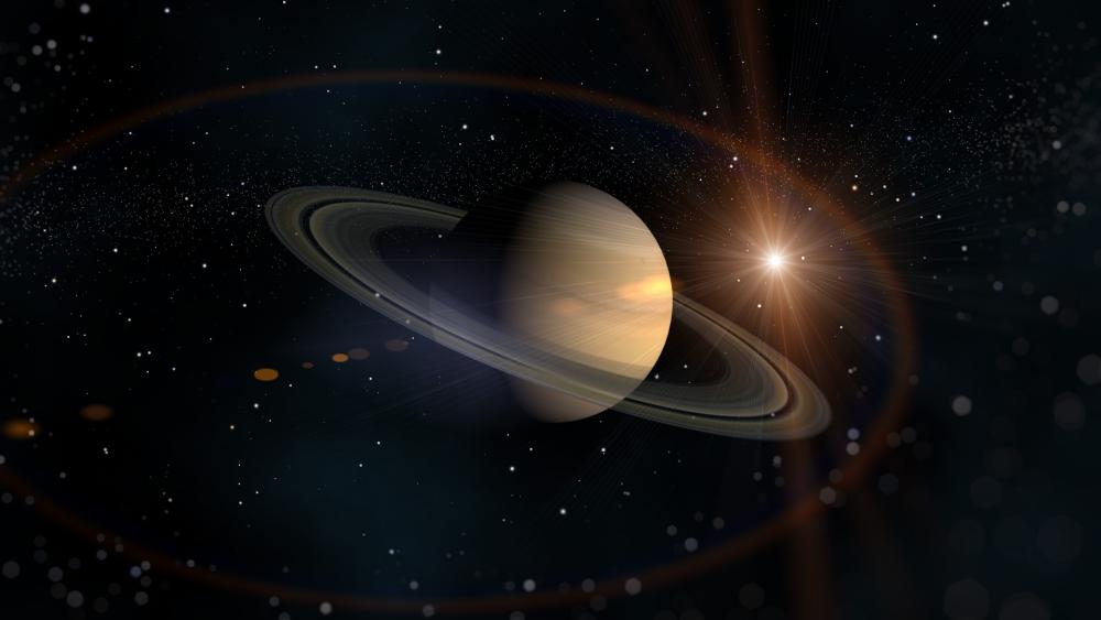 Saturn's Cosmic Dance in Space wallpaper