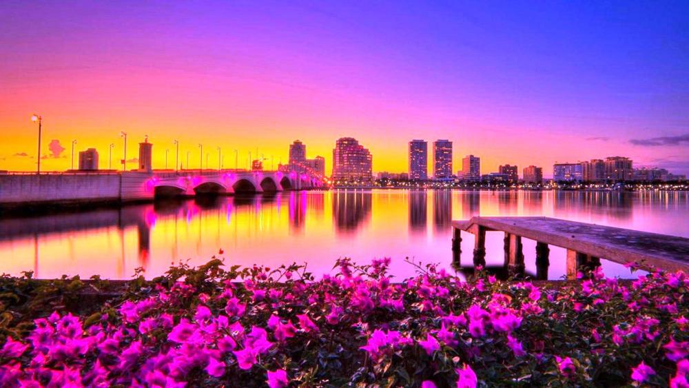 Vibrant Sunset Over Luminous Cityscape wallpaper