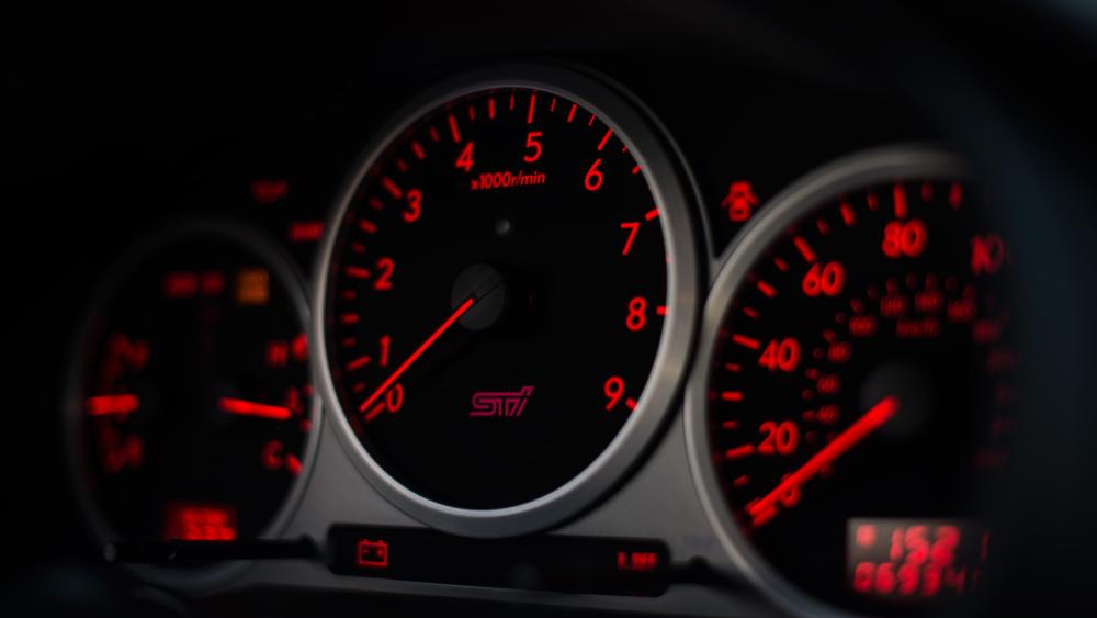 Red Glowing Speedometer: Automotive Power Display wallpaper