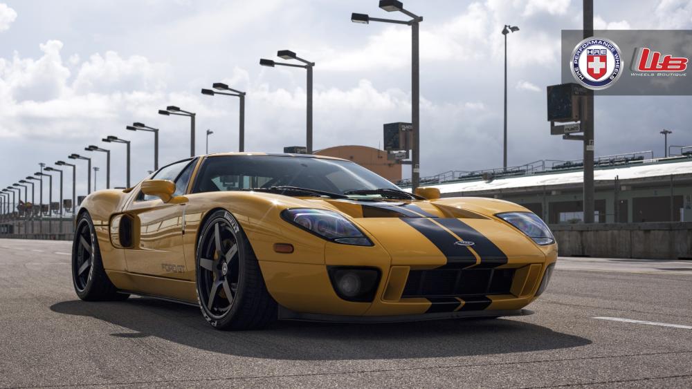 Yellow Ford GT at Racetrack in 4K wallpaper