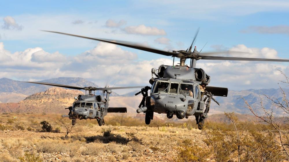 Military Helicopters in Desert Operation wallpaper