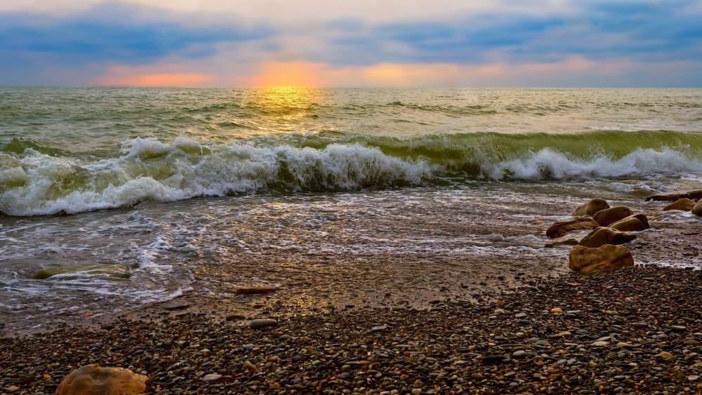 Sunset Waves on a Rocky Shore wallpaper