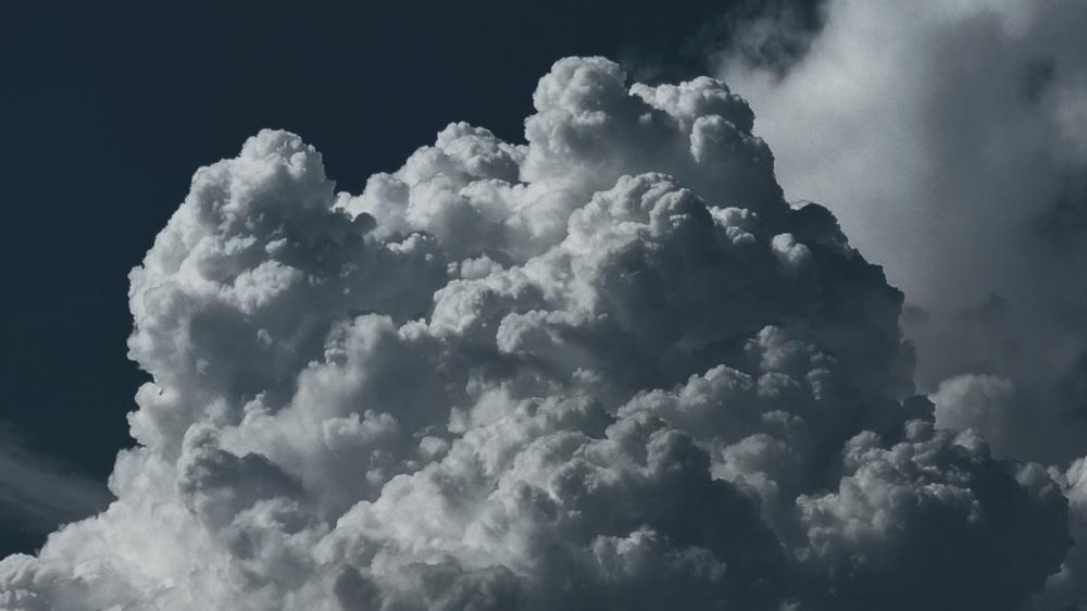 Calm Before the Storm: Majestic Clouds in Motion wallpaper