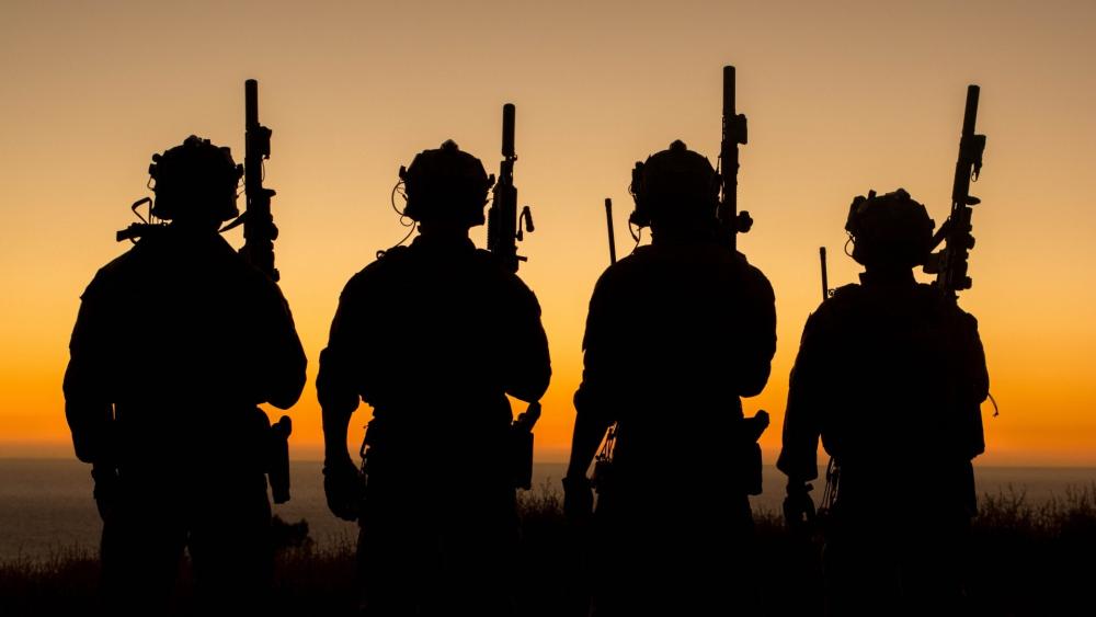 Sunset Silhouettes of Commandos in Action wallpaper