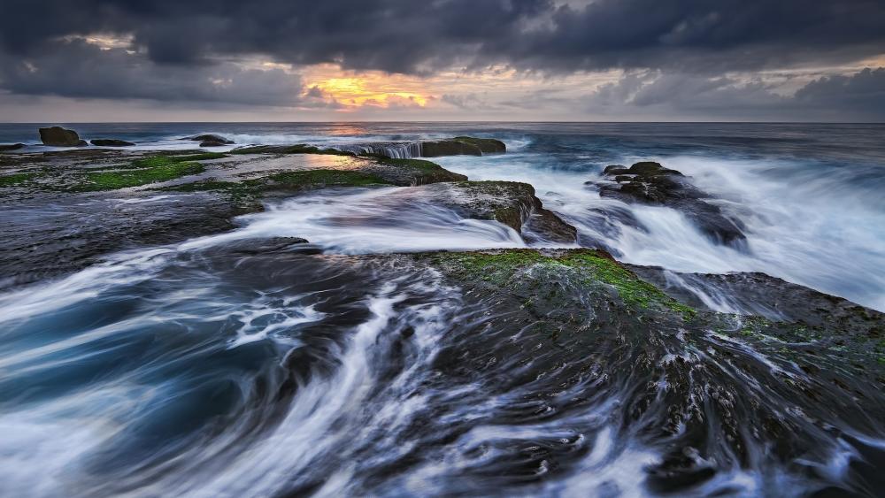 Coastal Serenity Under Dramatic Skies wallpaper